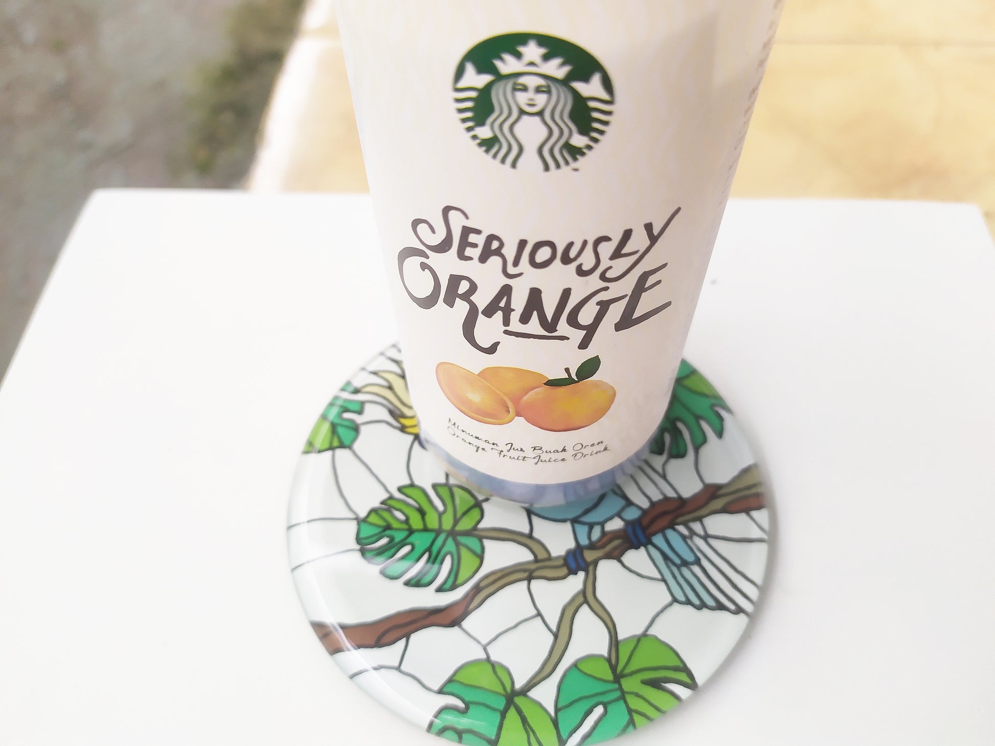 Mirror and glass hand painted bird coaster , with starbucks cup