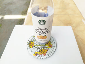 Reverse Painted Yellow Buttercup round mirror coaster , with starbucks cup
