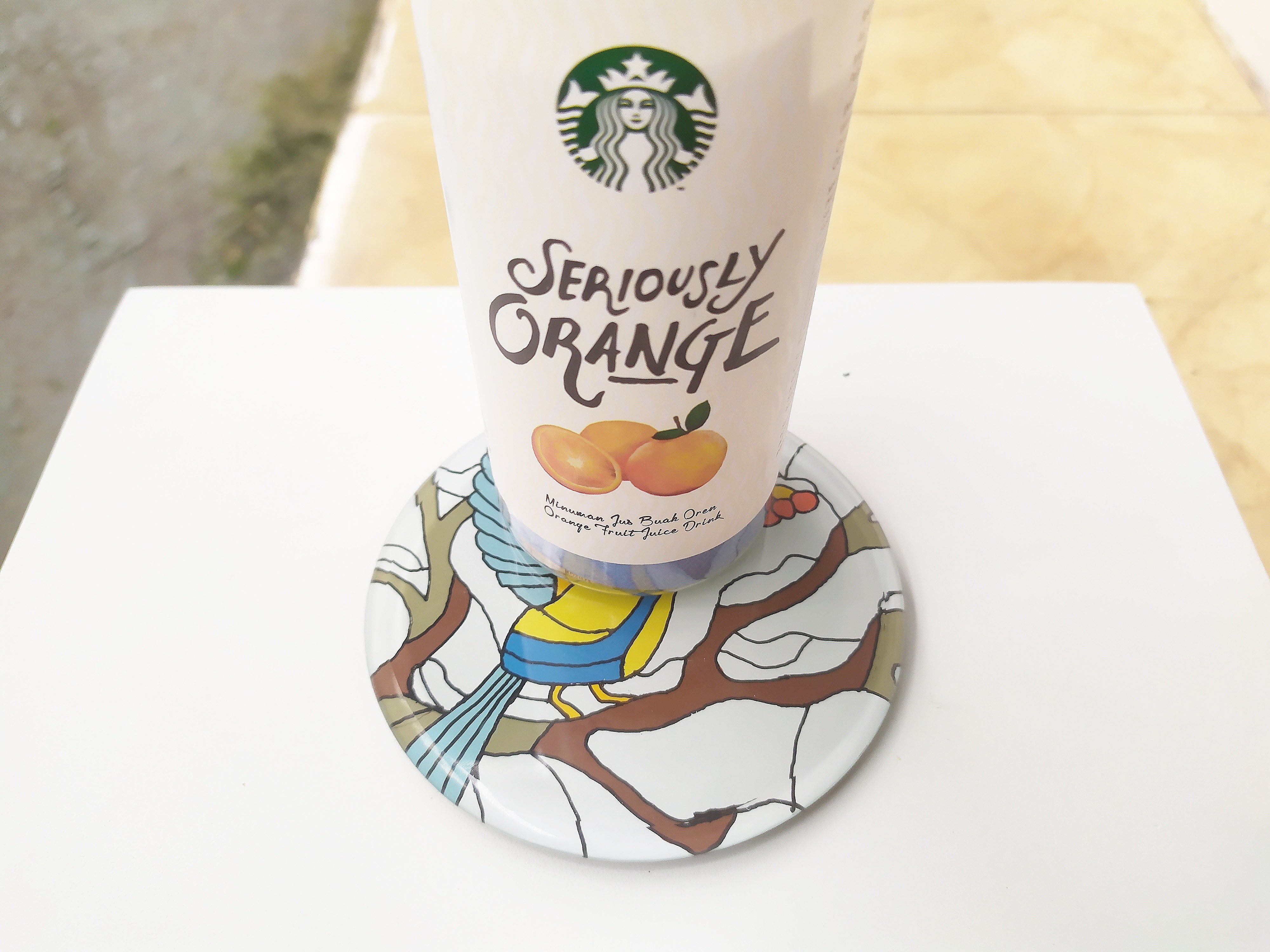 Mirror and glass hand painted bird coaster , with starbucks cup