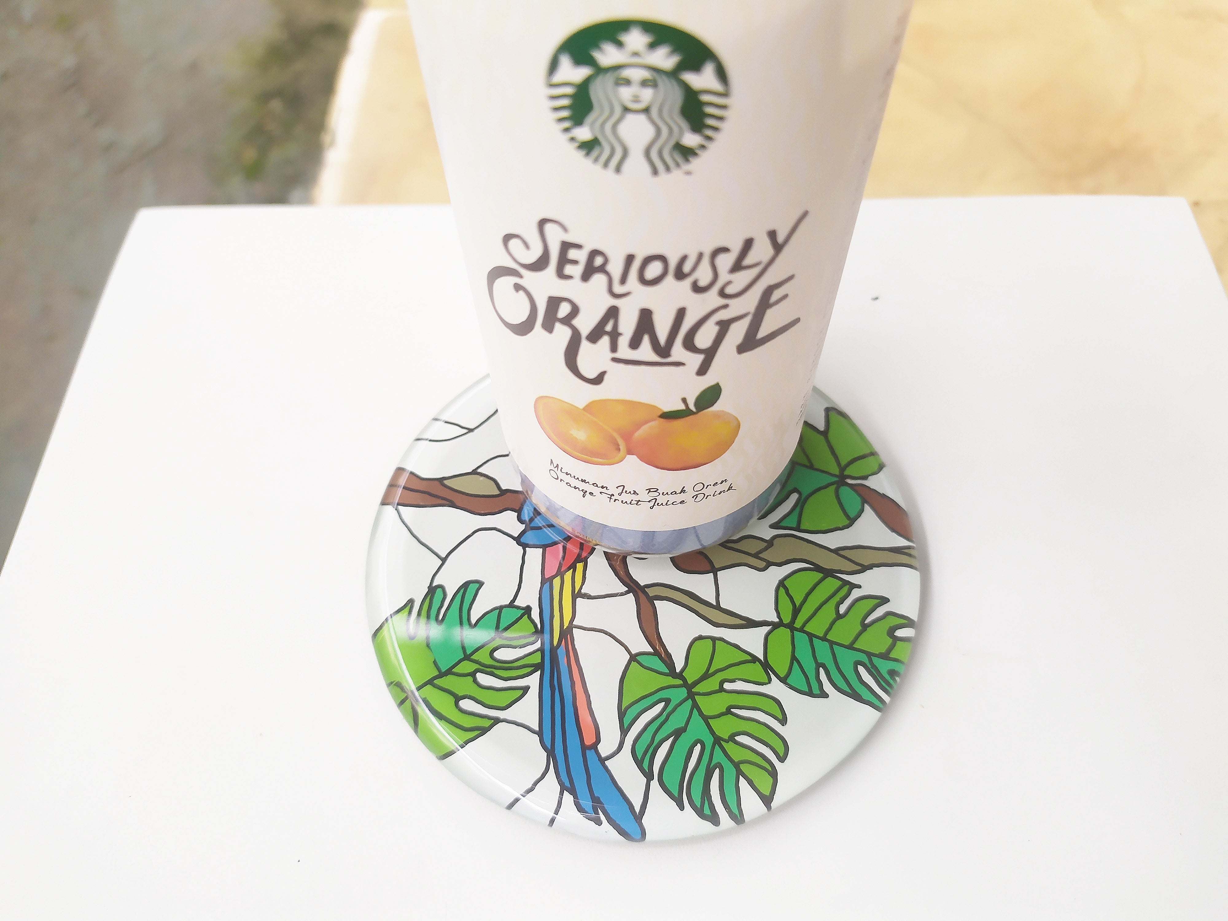 Hand Painted Colorful Parrot round on  branch mirror coaster , with starbucks cup