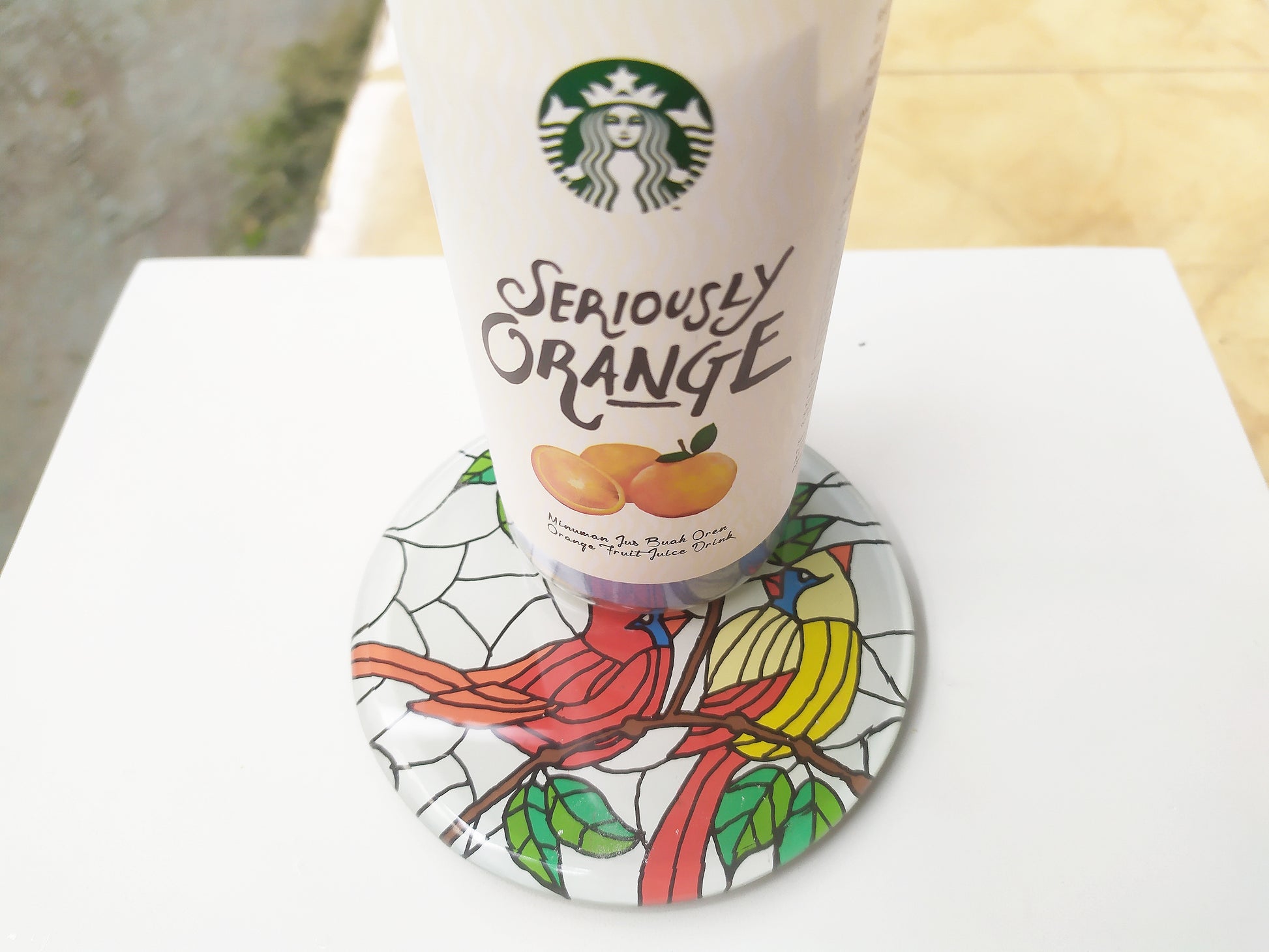 Mirror and glass hand painted bird coaster , with starbucks cup